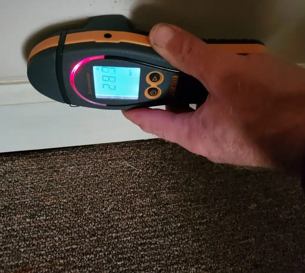 Moisture detection at baseboard during Storm Damage Restoration in Campbell